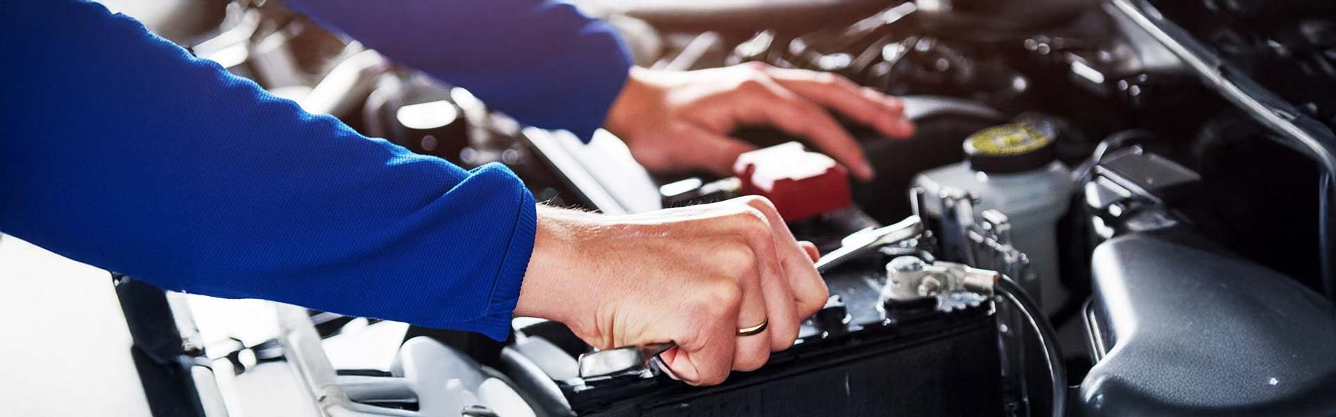 Mechanic Working on Battery Panama City, FL